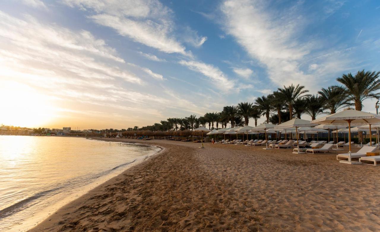 Sunrise Tucana Resort Grand Select Hurghada Exterior photo Sunset at the beach of the Hilton Sharm El Sheikh Resort